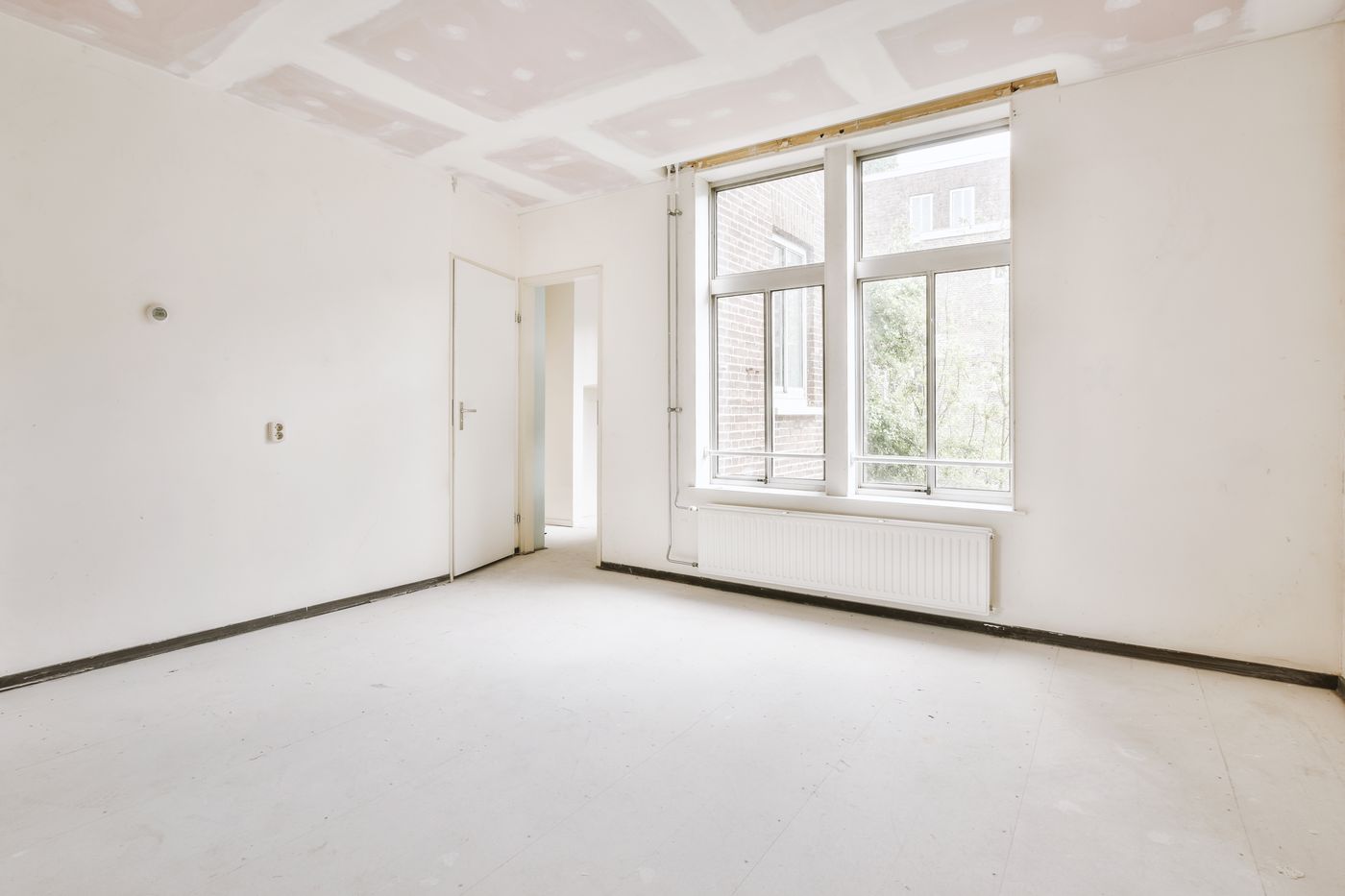 Bright empty room after a complete junk removal cleanout