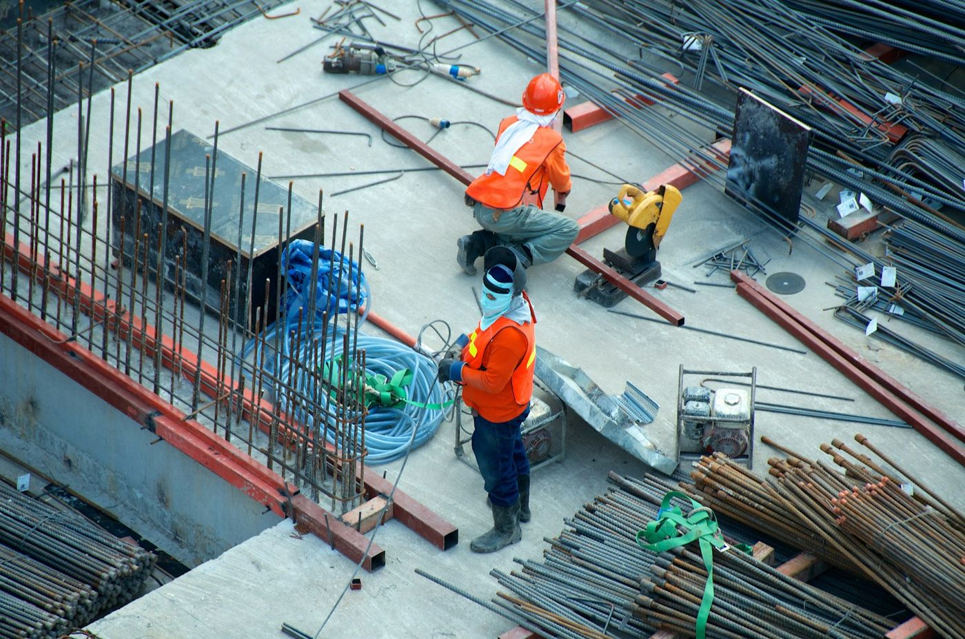 An active construction job site with materials and crews at work