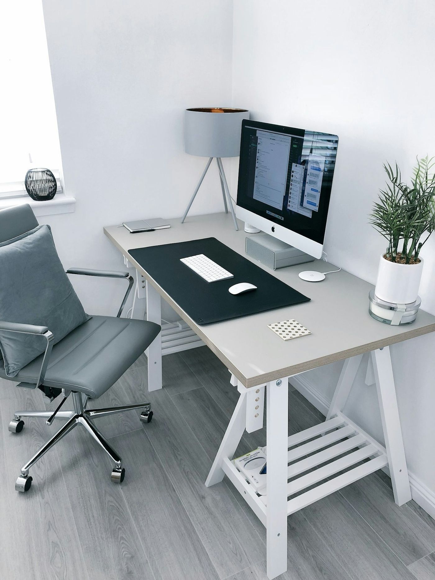 Organized desk with notebook and laptop